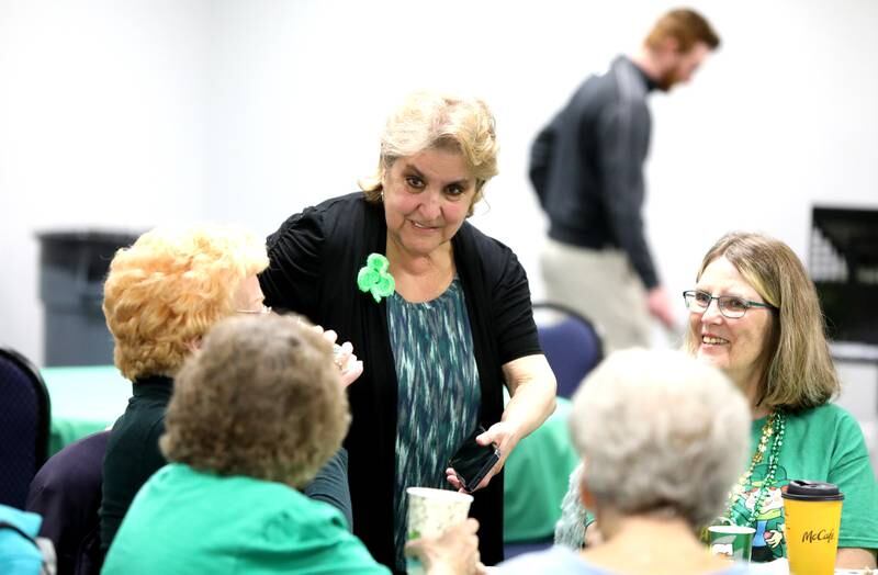 Phyllis Klazcyski of Hodgkins chats with friends including Anna Schawel of Brookfield (right) during a St. Patrick’s Day social event on Monday, March 17, 2025 at the Park District of La Grange.