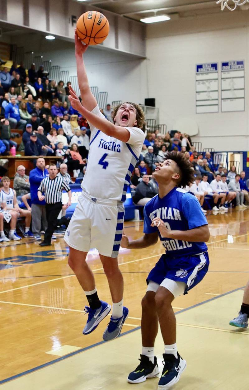 Princeton's Jayden Fulkerson scores on a layup off a halfcourt inbounds play against Newman Friday night at Prouty Gym.