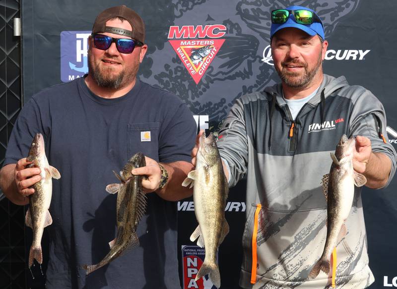 Tyler DeBernardi of Ottawa, and J.J. DeBernardi of Wayne, hold up their walleye during the annual Masters Walleye Circuit tournament on Friday, March 20, 2026 at the Spring Valley Boat Club.