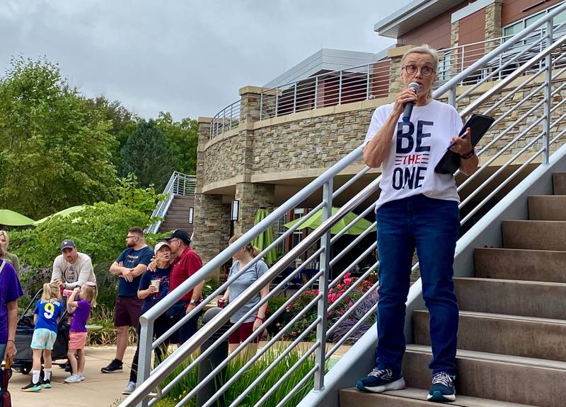 Cindy Hupke, member of the DeKalb American Legion Auxiliary and head organizer, gives remarks and thanks participants at the Sunday morning, Sept. 22, 2024, at the inaugural Be the One Walk, part the Legion's campaign to end veteran suicide. The event kicked off at Northwestern Medicine Health and Wellness Center, 626 Bethany Road, DeKalb.