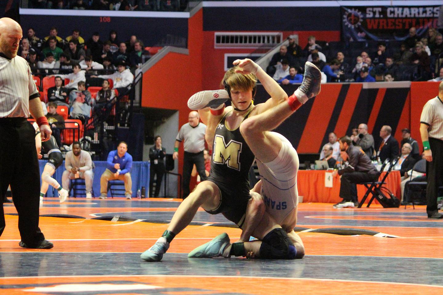 Polo's Wyatt Doty flips his opponent in a 132-pound wrestleback bout at the IHSA Individual State Finals on Saturday, Feb. 18, 2023 at State Farm Center in Champaign.