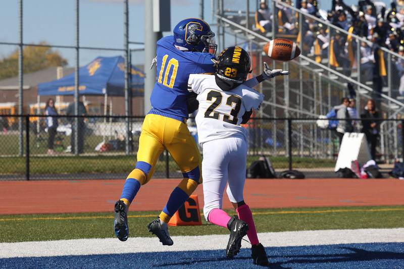 Joliet Central’s Jay Zepeda draws the pass interference trying to catch a pass against Joliet West in the cross town rival matchup on Saturday.