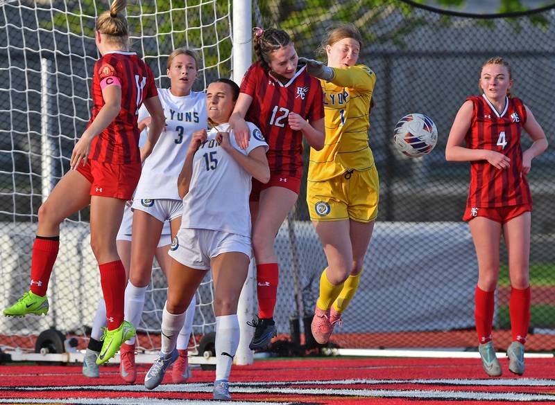 Lyons Township goalkeeper Anna Bigenwald (1) swats the ball away after a Hinsdale Central corner kick during a game on April 29, 2025 at Hinsdale Central High School in Hinsdale.