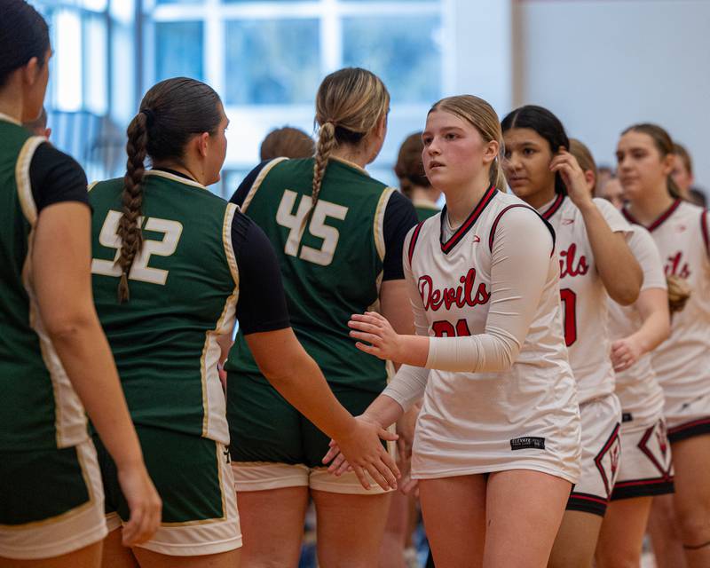 Ava Delphi (21) of Hall leads team in post-game high five line on Saturday, January 31, 2026 at Hall High School in Spring Valley.
