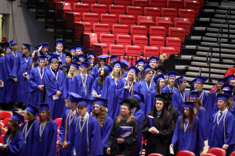 St. Charles North students enter the Northern lllinois University Convocation Center for the school’s annual commencement Ceremony in DeKalb on Monday, May 23, 2022.