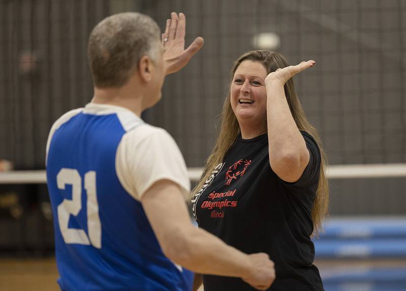 Coach Sarah Heather high-fives Bob during practice Wednesday, Dec. 18, 2024, in Dixon.