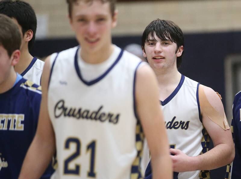Marquette's Alec Novotney smiles while walking off the court after defeating Seneca on Friday, Feb. 21, 2025 in Bader Gym at Marquette Academy.