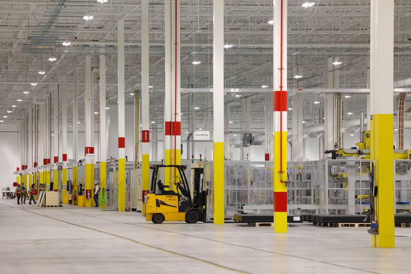 Workers tend to Pack Line A at Gotion Illinois in Manteno on Oct. 1, 2025. The battery manufacturing plant has plans to expand its workforce to 450 jobs by the end of 2025, with the goal of reaching 1,400 jobs in 2026.