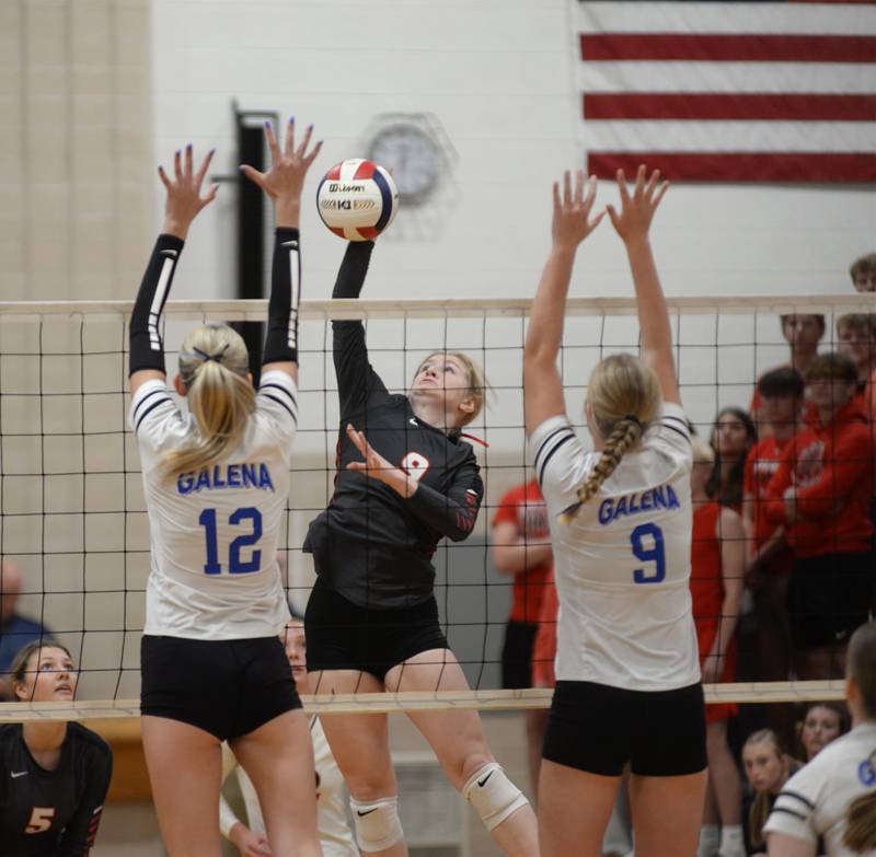 Fulton's Olivia Knott (9) spikes the ball as Galena's Mya McCoy (12) and Alexa Stroyan (9) go up to block during 1A action at the Polo Sectional on Tuesday, Nov. 5, 2024 at Polo High School.