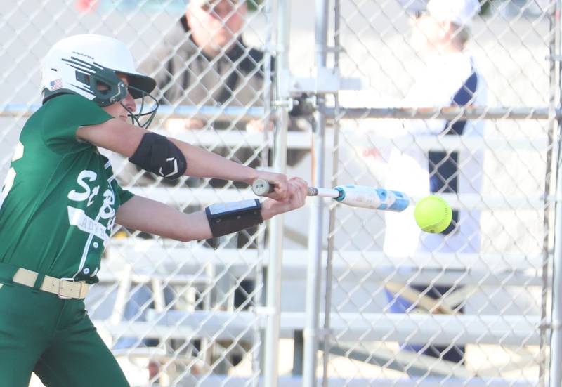 St. Bede's Emma Slingsby makes contact with the ball against Marquette on Tuesday, April 23, 2026 at June Cross Field in Ottawa.