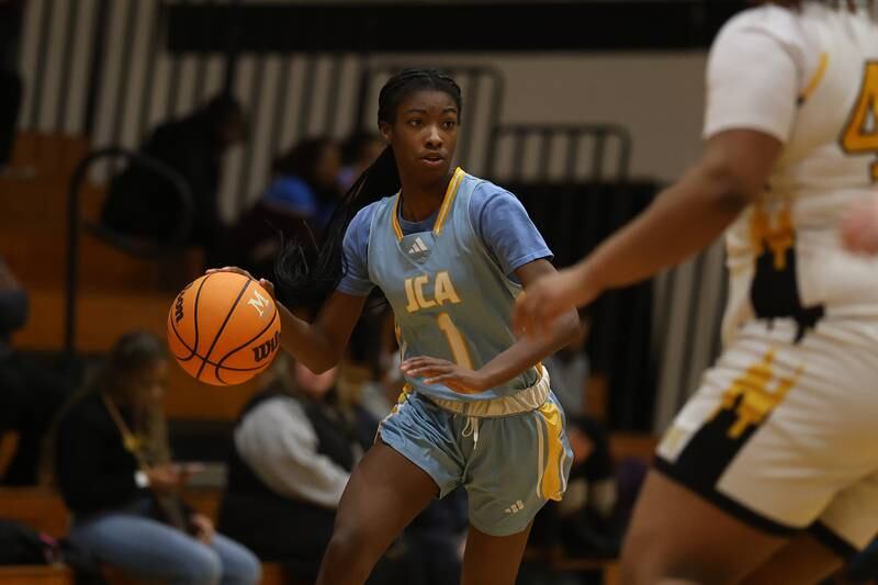 Joliet Catholic’s Makenzie Ketlz works the ball against Marian Catholic on Wednesday, Jan. 14, 2026 in Chicago Heights.