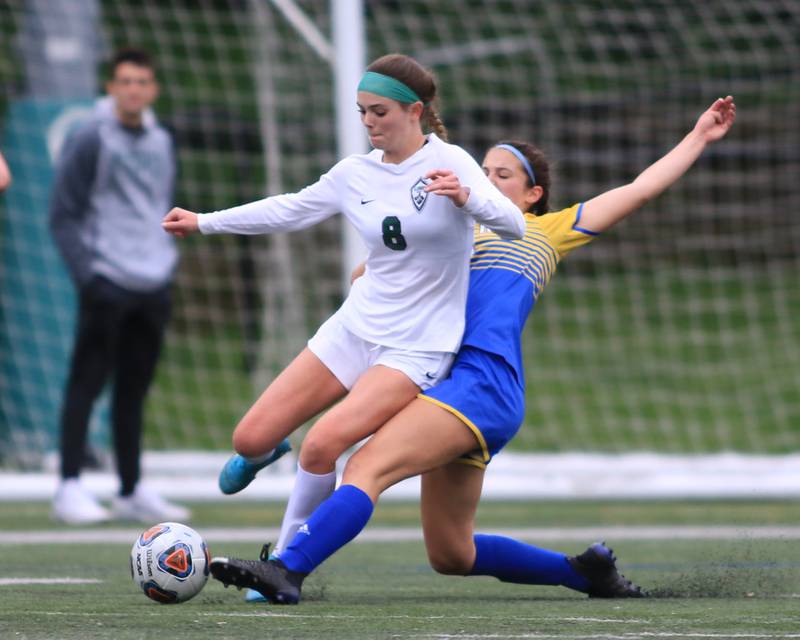 Glenbard West's Sophia Brown (8) fights off the defense during the Class 3A Glenbard West Sectional final game between Lyons at Glenbard West. May 27, 2022