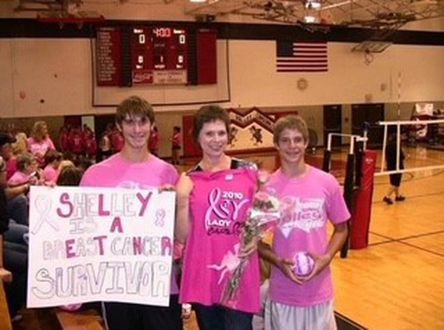 Shelley Herlihy was honored at Volley for Cure at Stillman Valley High School. She is shown with her sons, Tanner and Tyler Herlihy, in October 2010.