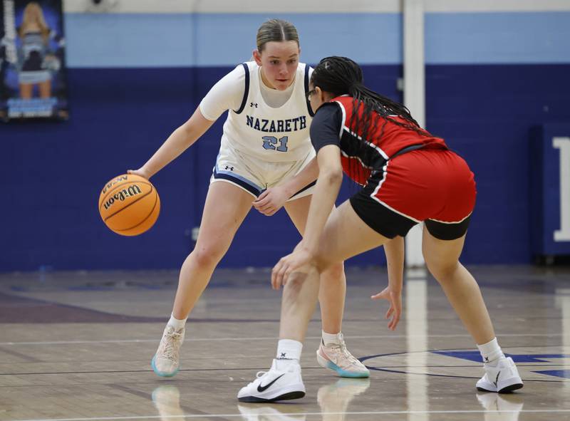 Nazareth's Lyla Shelton (21) plans her move during the girls varsity basketball game between Bolingbrook high school and Nazareth Academy on Monday, Jan. 12, 2026 in La Grange Park.