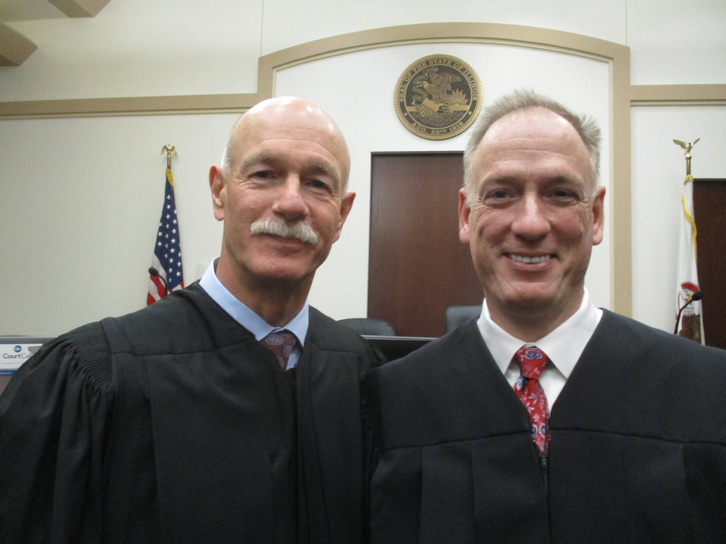 Illinois Supreme Court Justice Michael Burke, left, administered the oath of office as full circuit judge in the 23rd Judicial Circuit to John McAdams of Yorkville at the Kendall County Courthouse on Aug. 19.