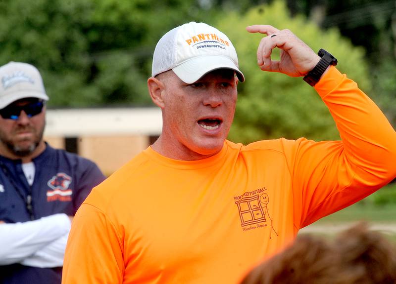 Oswego Head Coach Brian Cooney talks to his players after football practice at Oswego High School on Monday, Aug 7, 2023.