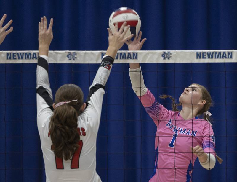 Newman’s Lauren McClain plays the ball against Erie-Prophetstown’s Kayler Pritchard Tuesday, Oct. 14, 2025.