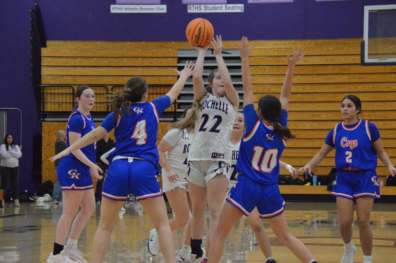 Rochelle's Preslee Sanders (22) shoots and scores during a JV girls basketball game against Genoa-Kingston. Rochelle won the game 37-23.