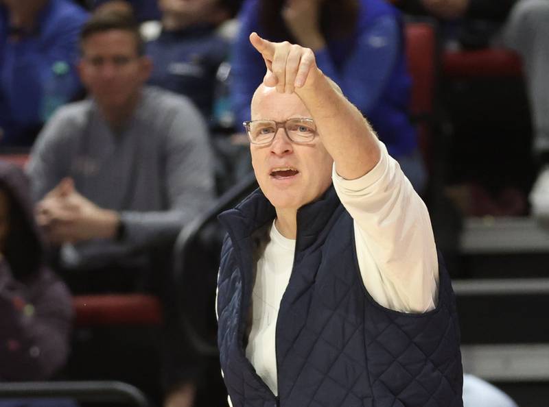 Nazareth head girls basketball coach Eddie Stritzel coaches his team during the Class 4A State girls basketball championship game on Saturday, March 7, 2026 at CEFCU Arena in Normal.