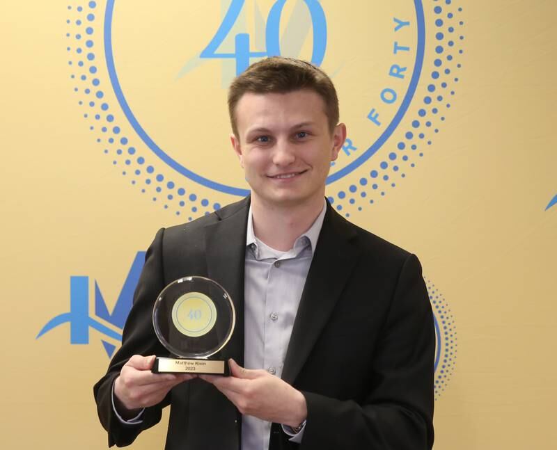 Matthew Klein poses for a photo Courtney Levy poses for a photo with his award as one of the 40 Under Forty recipients on Monday, March 25, 2024 at Illinois Valley Chamber of Commerce in Peru.