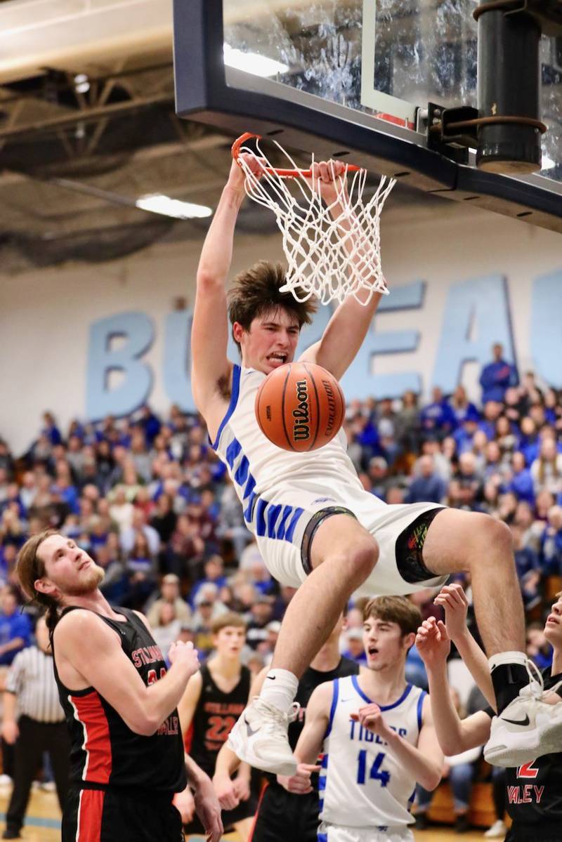 Princeton sophomore Noah LaPorte throws down a dunk in the third quarter of Friday's regional championship game at the Storm Cellar. The Tigers defeated Stillman Valley, 68-37, to repeat as regional champions.