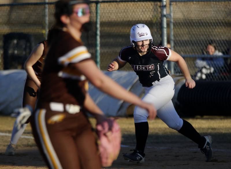 Marengo's Elizabeth White looks at the batter as she breaks towards second base during a nonconference softball game against Jacobs on Monday, March 9, 2026, at Marengo High School.