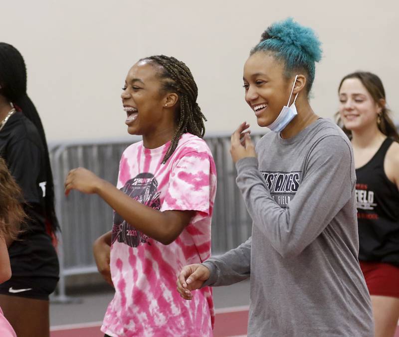 Sisters Alex and Dominique Johnson joke around as they work out Monday, April 4, 2022, during track practice at Huntley High School The sisters are among the best long and triple jumpers in the state. Alex won long jump and Dominique won the triple jump at the indoor state meet this year.