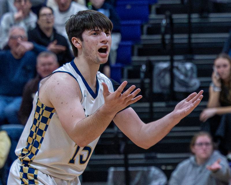 Marquette's Alec Novotney (15) reacts after officials call during the Class 1A Regional Boys Basketball Championship game on Friday, Feb. 27, 2026 at Serena High School.
