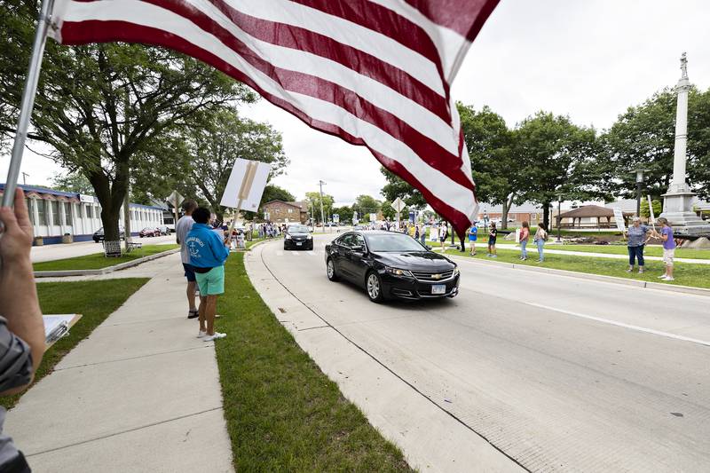 Protesters line East Fourth Street in Sterling on Thursday, July 17, 2025.