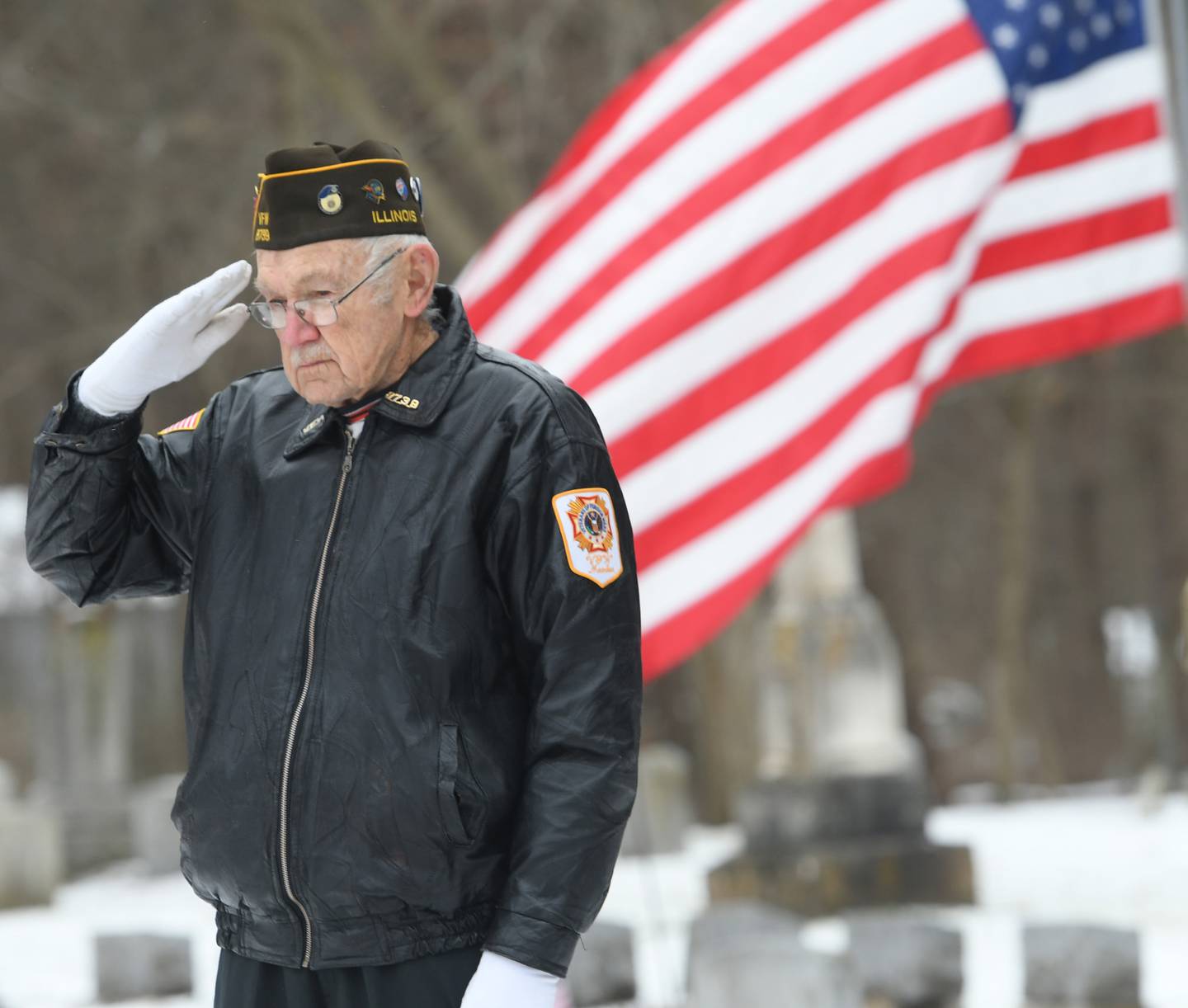 Stan Eden of Oregon, a Korean war veteran, salutes after laying a wreath in honor of the Merchant Marines, at Daysville Cemetery on Dec. 17 during the Wreaths Across America project.