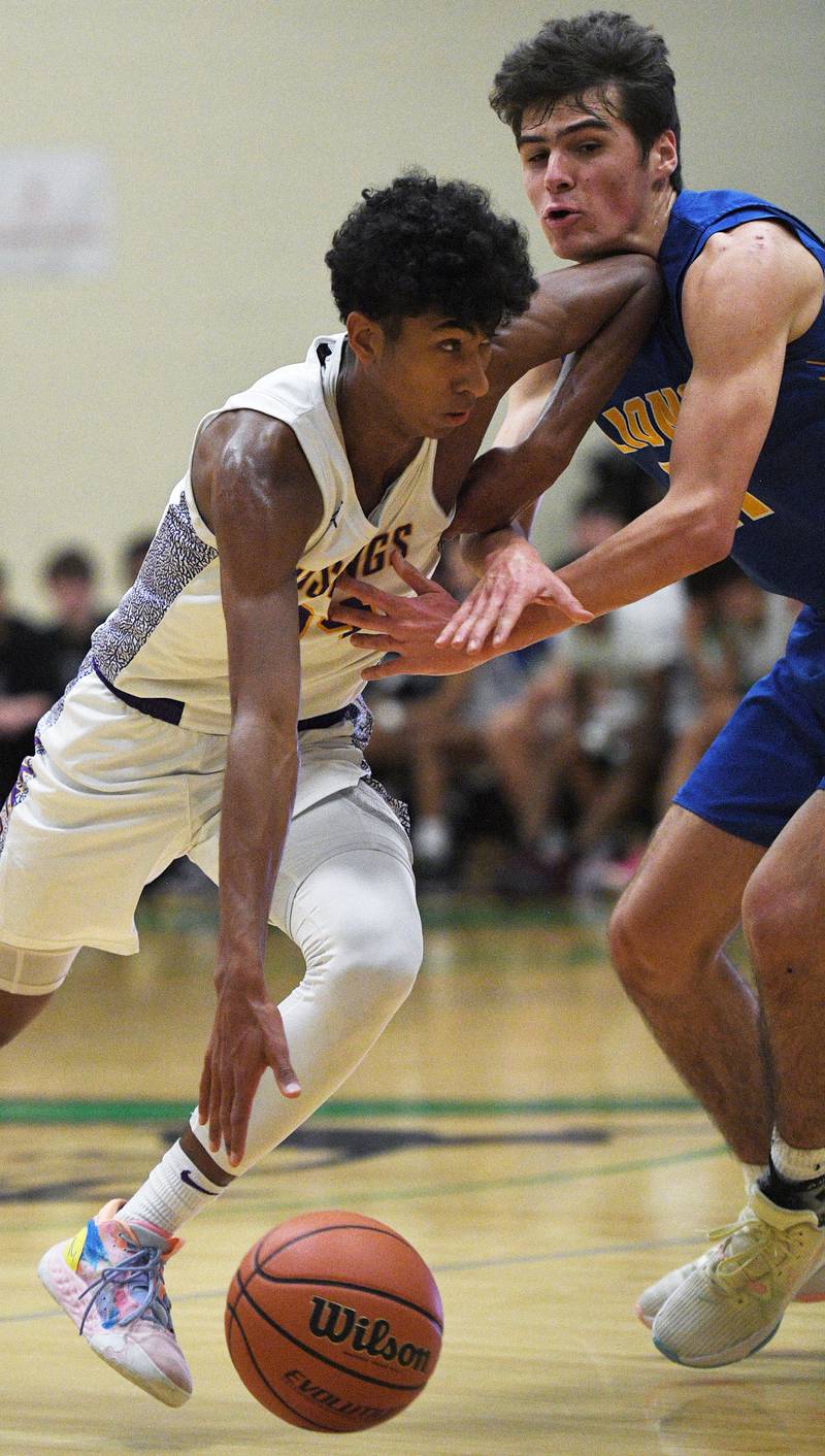 John Starks/jstarks@dailyherald.com
Rolling Meadows' Cameron Christie elbows Lyon’s Matthew DeSimone in the throat as he drives past in the Jack Tosh boys basketball tournament at York High School in Elmhurst on Friday, December 30, 2022.