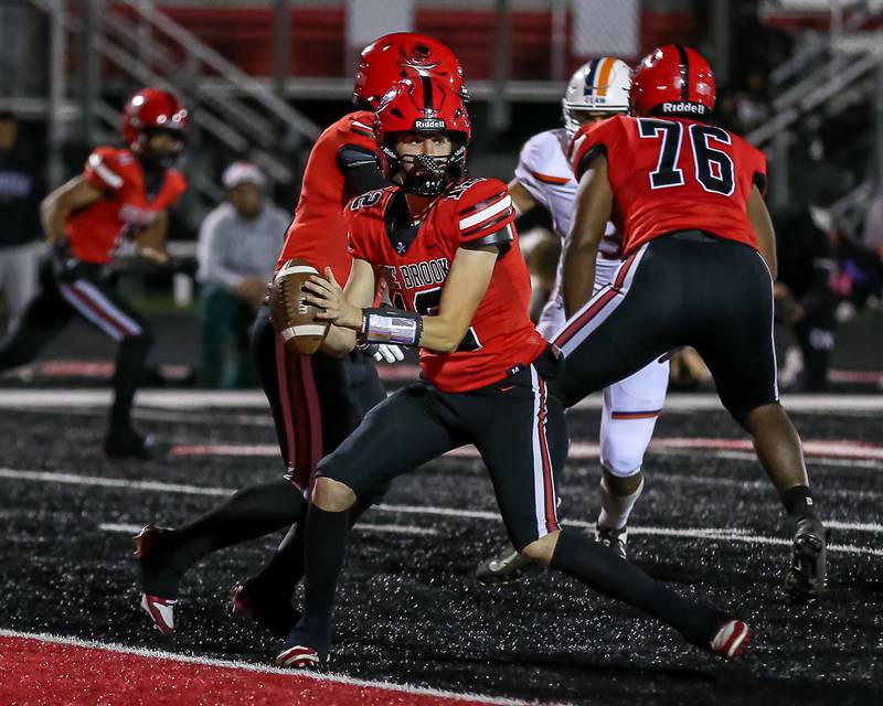 Bolingbrook's Braden Andersen (12) drops back to throw during a football game between Oswego at Bolingbrook on Friday, Oct 4th, 2024  in Bolingbrook.