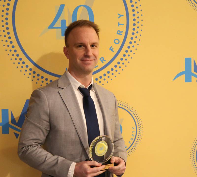 Christopher Safranski poses for a photo with his award during the 40 Under Forty awards banquet on Thursday, March 21, 2024 at Westclox in Peru.