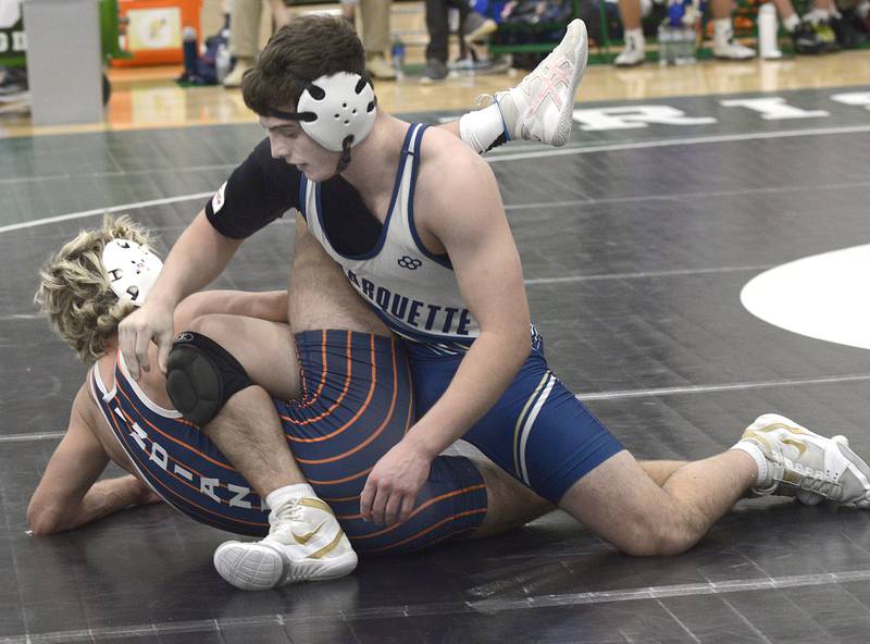 Marquette’s Beau Thompson works for control in the 144# match against Pontiac’s Drayden Ramsey Wednesday at Seneca.