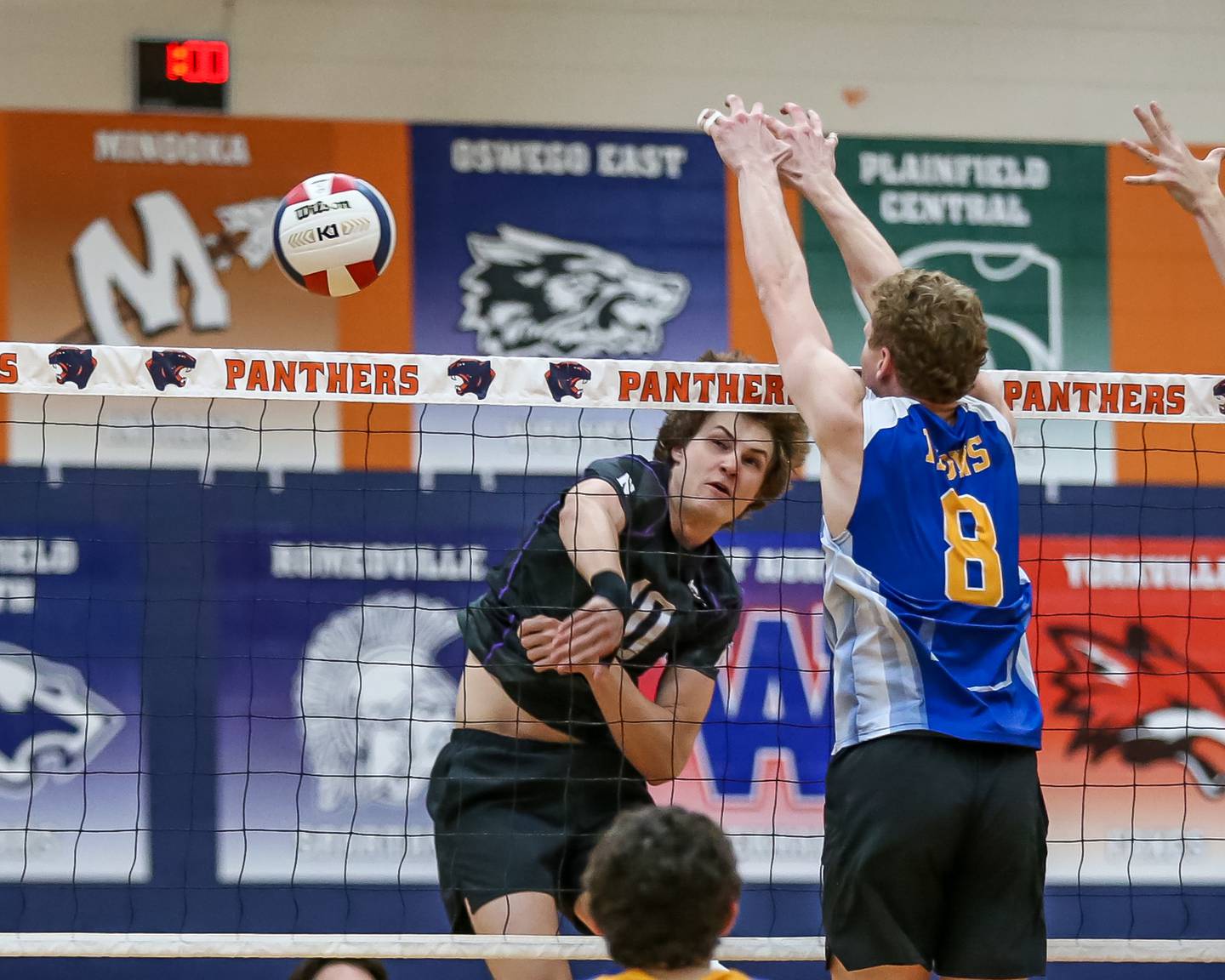 Downers Grove North's Adam Janowiak (10) spikes the ball in the direction on Lyons Zaccary Ruiz (11) during Oswego Sectional final between Downers Grove North at Lyons.  May 30, 2023.