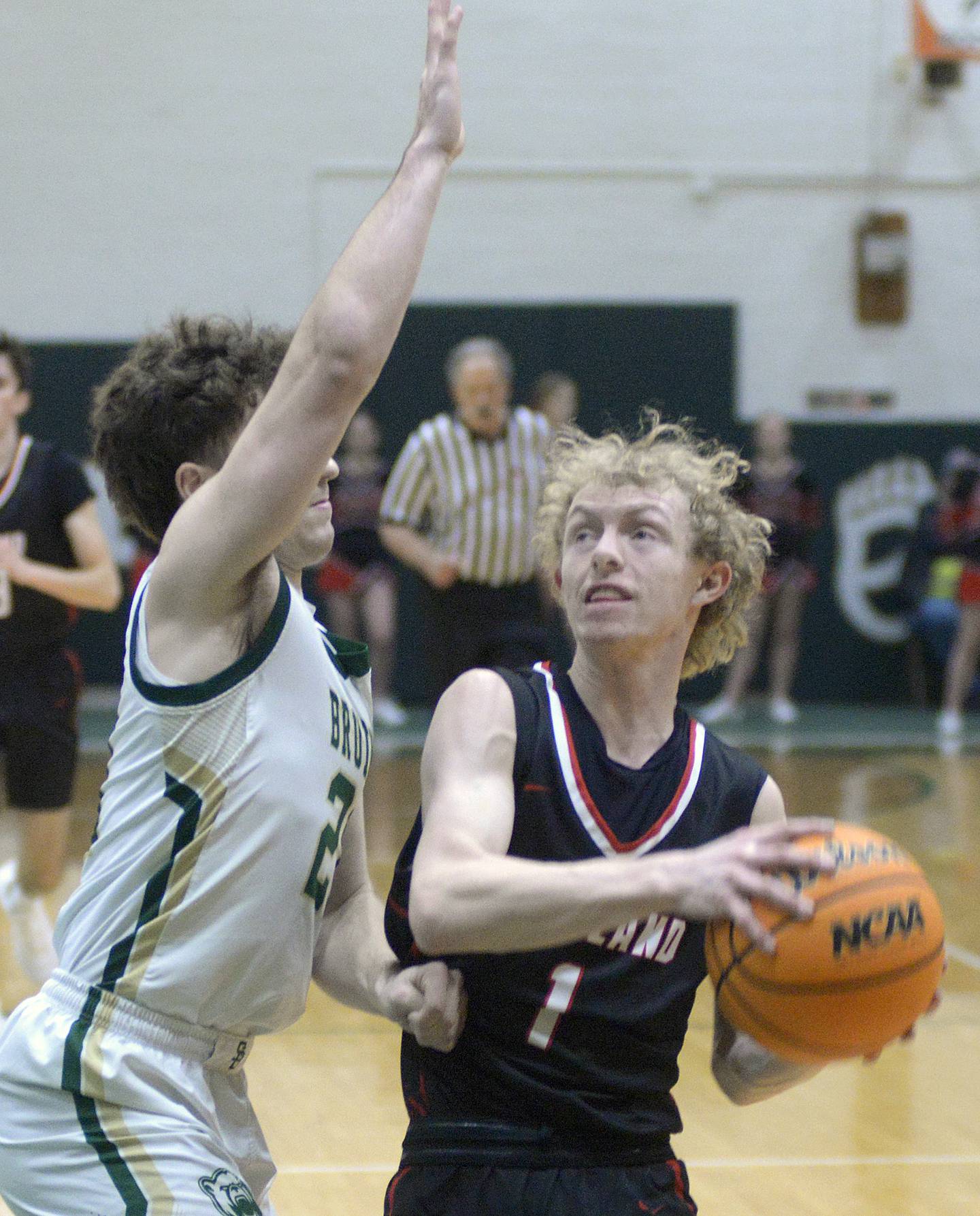 Woodland’s Connor Dodge looks to rise to the basket against St Bede’s Kaden Nauman in game this past season at St Bede Academy.