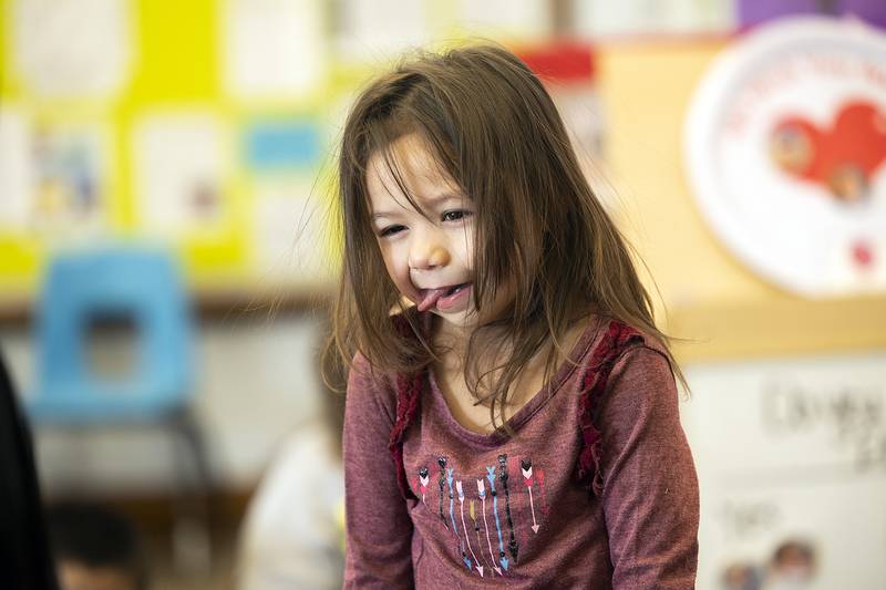 A class greeter at Tri-County Opportunities Council Early Head Start/Head Start offers a silly face Thursday, Jan. 23, 2025, to her classmates in Sterling. The recipient can opt for a hug, silly face or can pass.
