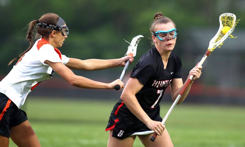 Crystal Lake Central United’s Addie Bechler, left, pressures  Huntley’s Aubrie Rohrbacher in IHSA Sectional Title Game action at Crystal Lake Central High School in Crystal Lake on Friday, May 30, 2025.