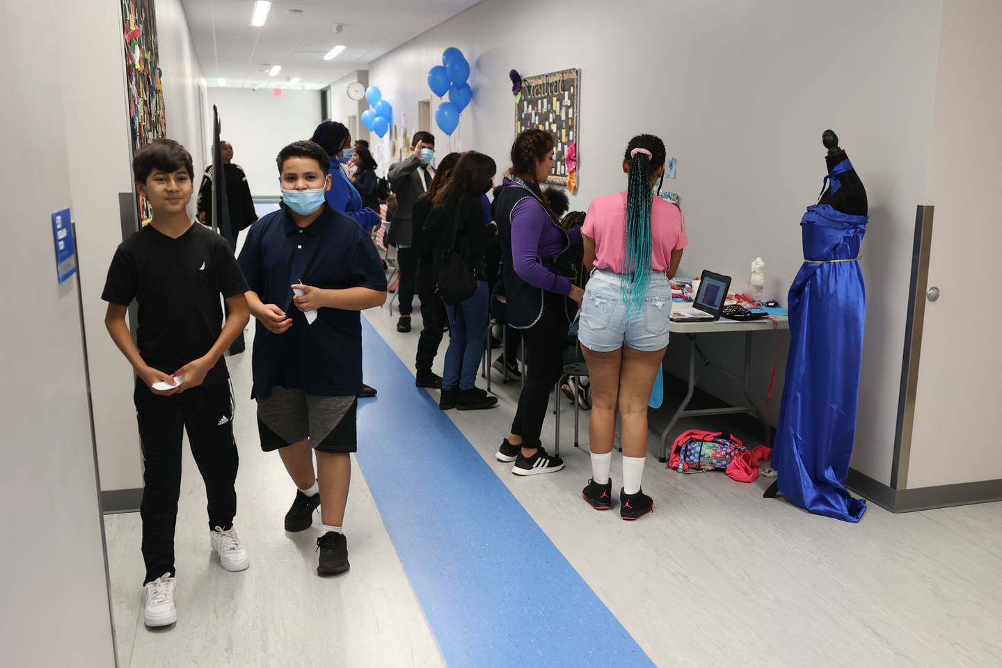 Students browse the various business booths set up at the Laraway 70C 5th Grade Business Expo. Friday, May 13, 2022, in Joliet.