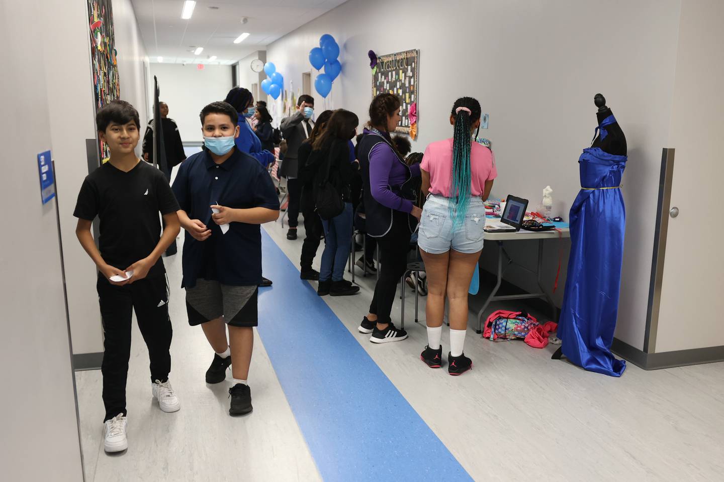 Students browse the various business booths set up at the Laraway 70C 5th Grade Business Expo. Friday, May 13, 2022, in Joliet.