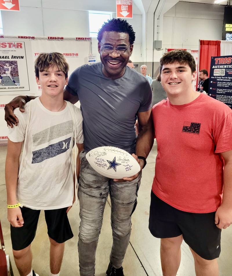 Brothers Reese (left) and Rhett Pearson of Princeton met up with NFL Hall of Famer Michael Irvin of the Dallas Cowboys. Their father, Ryan, the Tiger football coach, is a big Cowboys fan. When the Pearsons aren't involved in football, they often attend card shows.