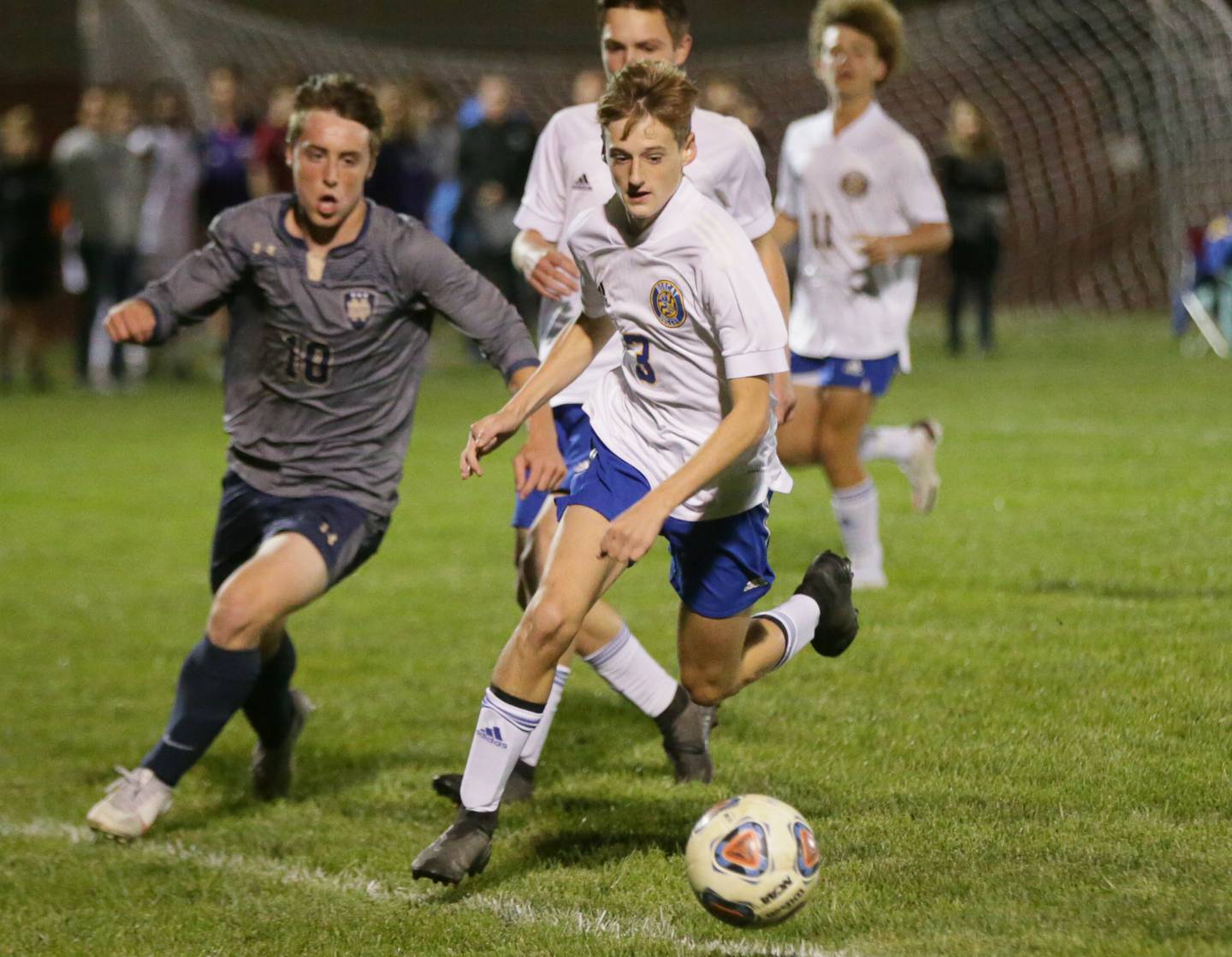 Somonauk's Chase Lafferty (3) kicks the ball downfield as Quincy Notre Dame's Jake Hoyt (10) defends in the Class 1A Sectional semifinal game in Chillicothe on Tuesday Oct. 19, 2021.