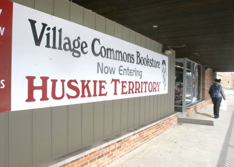 A customer leaves the Village Commons Bookstore Thursday afternoon in DeKalb. The store will be closing its doors for good Feb. 27 after 50 years in business.