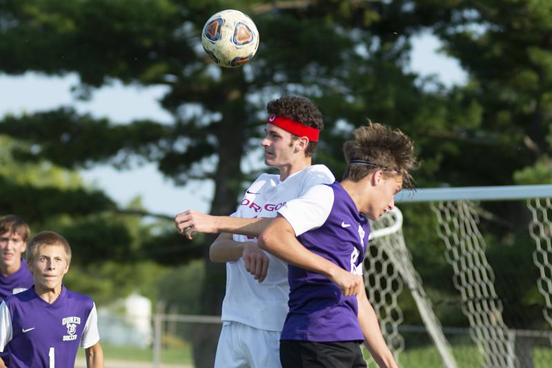 Oregon’s Miley Smith and Dixon’s Derek Miller head the ball on Wednesday, Sept. 14, 2022.