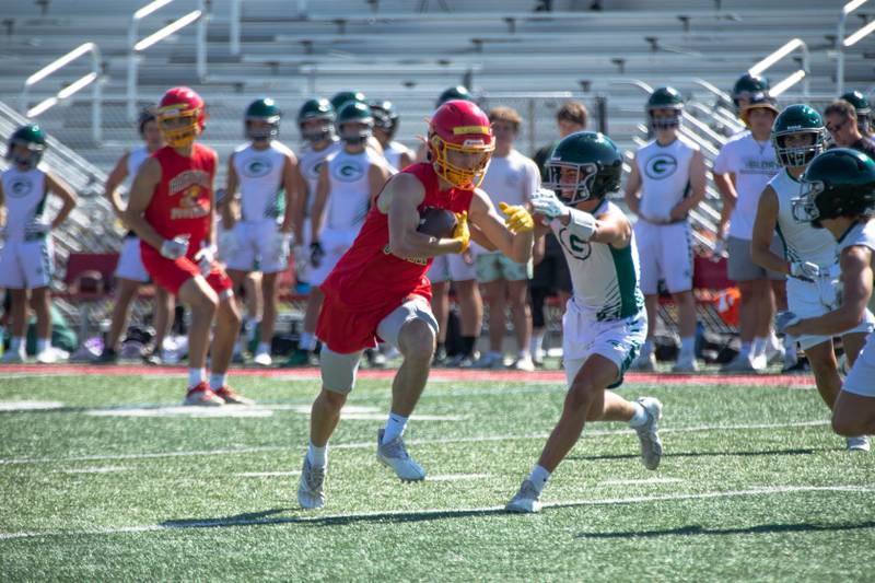 John Kohlmeir runs with the ball at Batavia High School's 7 on 7 tournament on Thursday, July 14, 2022.