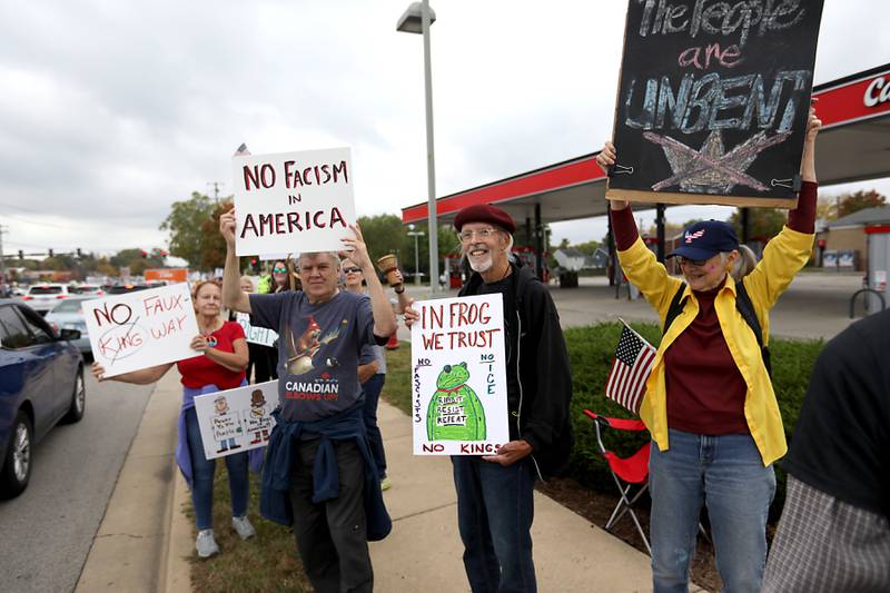 Protesters line Route 31 during a "No Kings” protest rally on Saturday, Oct. 18, 2025, in McHenry. The protest drew thousands of protesters to the area to protest the policies of President Donald Trump.