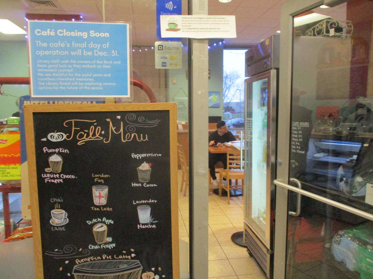 A sign posted above the Fall Menu at the Book and Bean Cafe advises people that the coffee shop at the Joliet Public Library Black Road Branch will close at the end of December. Dec. 2, 2024.