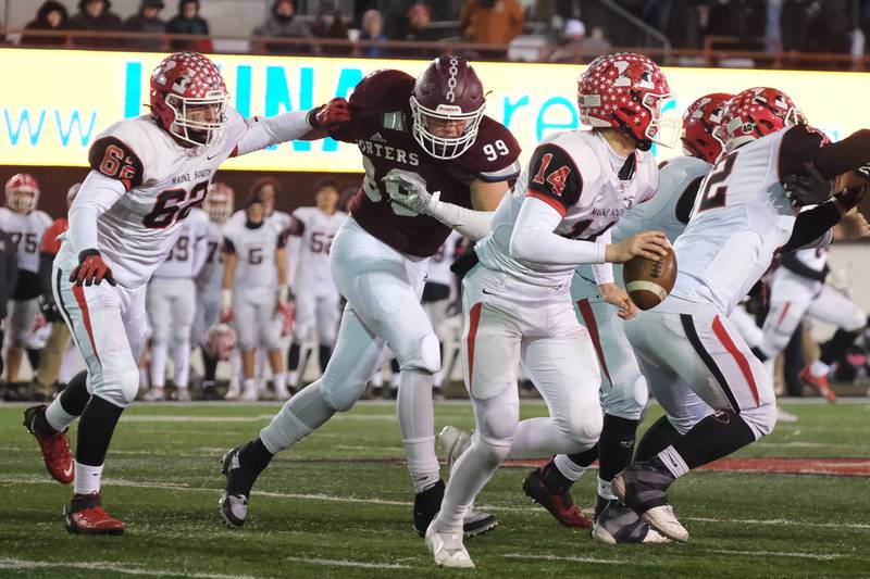 Lockport's Cody Silzer puts pressure on Maine Souths Rowan Keefe in the Class 8A state championship at NIU Huskie Stadium. Saturday, Nov. 27, 2021 in DeKalb