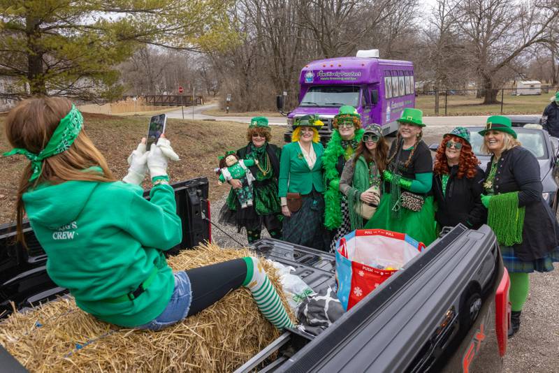 Cari Prybylinski takes a group photo of the Shenanigan Seekers at the St. Patrick's Day Parade on March 7, 2026 in Utica.
