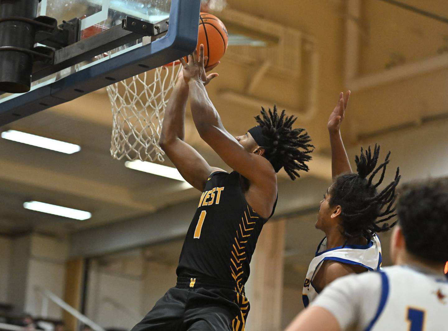 Joliet West's Mickeis Johnson (1) goes up strong for a shot during a conference game against Joliet Central on Thursday, Jan. 30, 2025, at Joliet.
